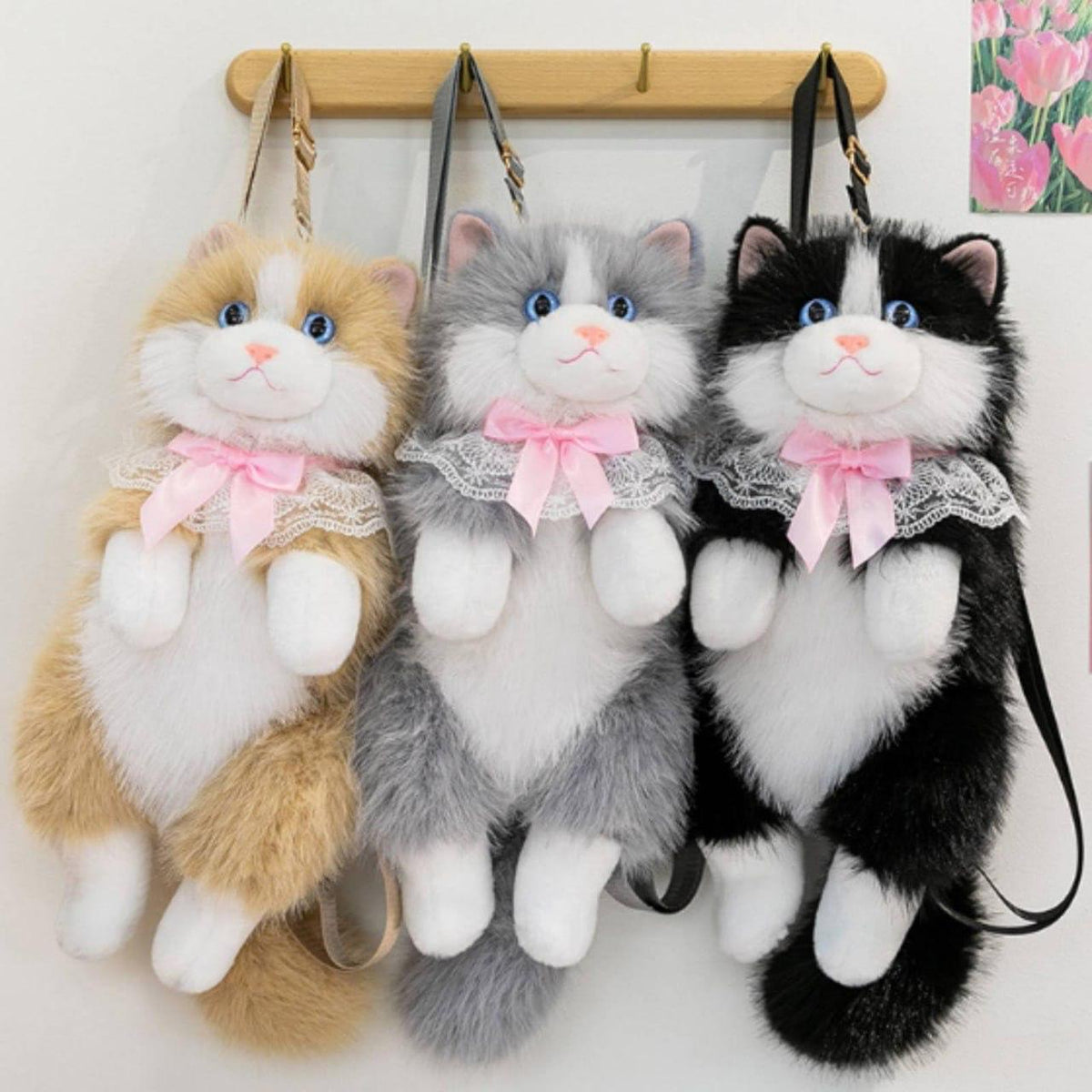 Mochila de peluche con forma de gato en tres colores